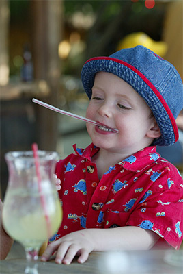 Ethan plays with a straw